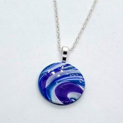 handmade polymer clay round pendant in blues, purples and white