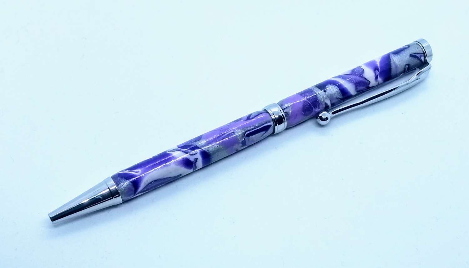 Hand made slimline twist ballpoint pen in purples, lilac, white and silver Hand made slimline twist ballpoint pen in purples, lilac, white and silver