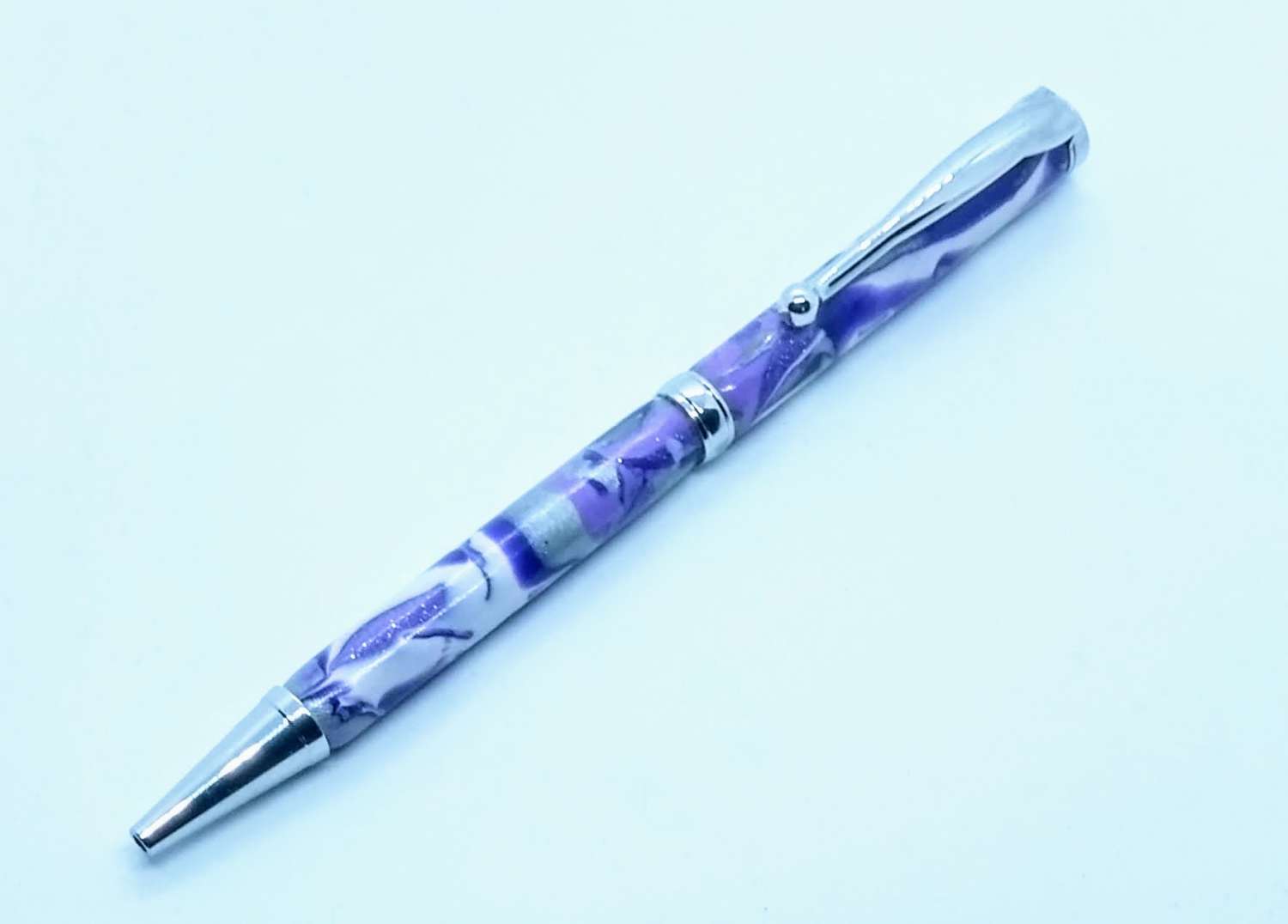 Hand made slimline twist ballpoint pen in purples, lilac, white and silver Hand made slimline twist ballpoint pen in purples, lilac, white and silver