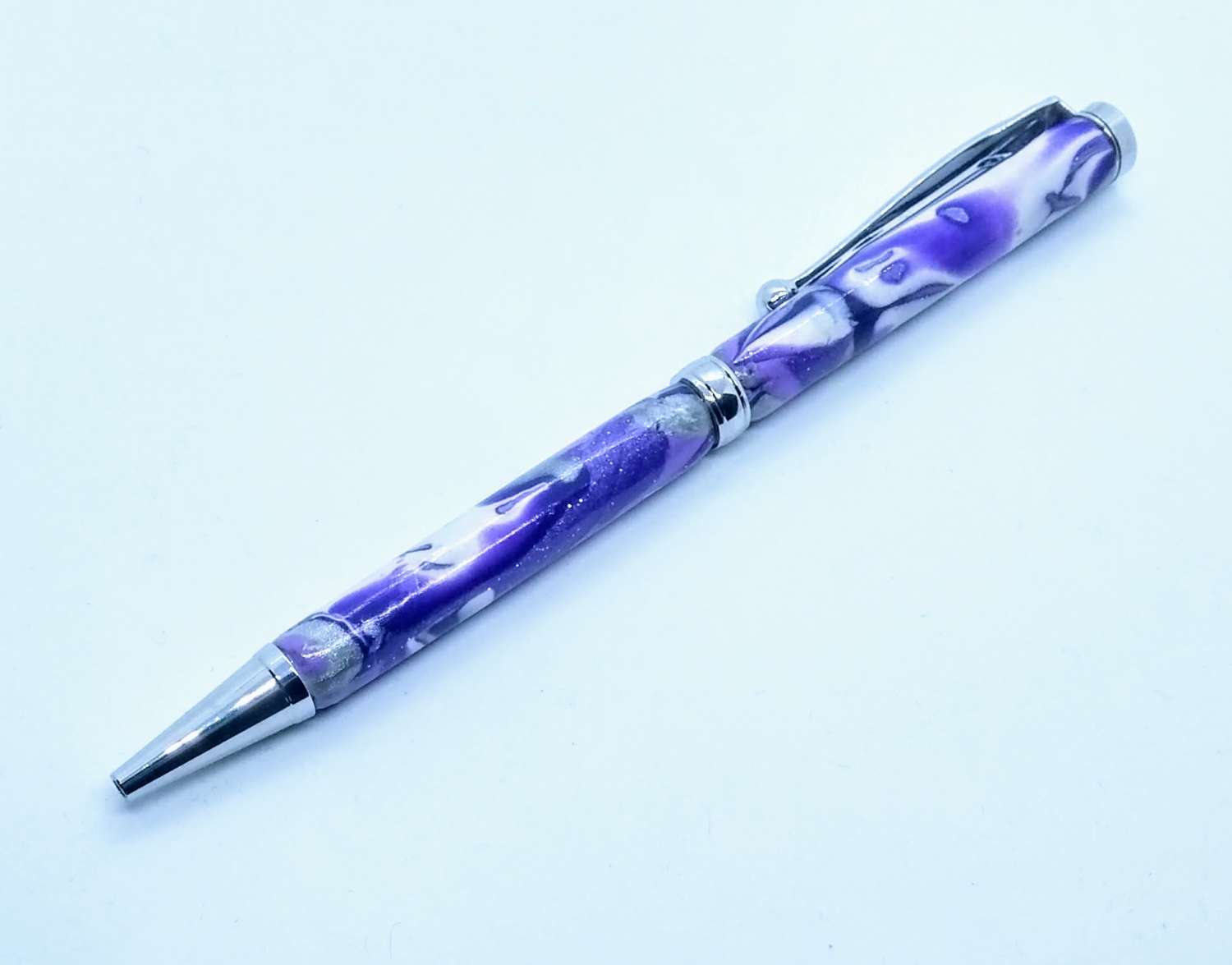 Hand made slimline twist ballpoint pen in purples, lilac, white and silver Hand made slimline twist ballpoint pen in purples, lilac, white and silver