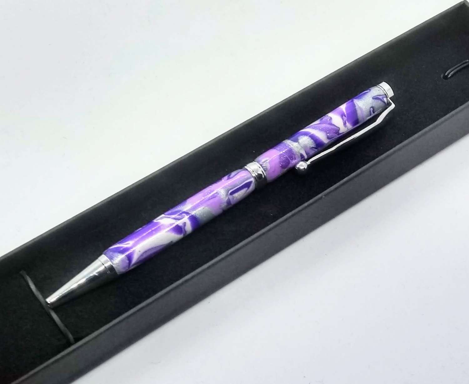 Hand made slimline twist ballpoint pen in purples, lilac, white and silver Hand made slimline twist ballpoint pen in purples, lilac, white and silver