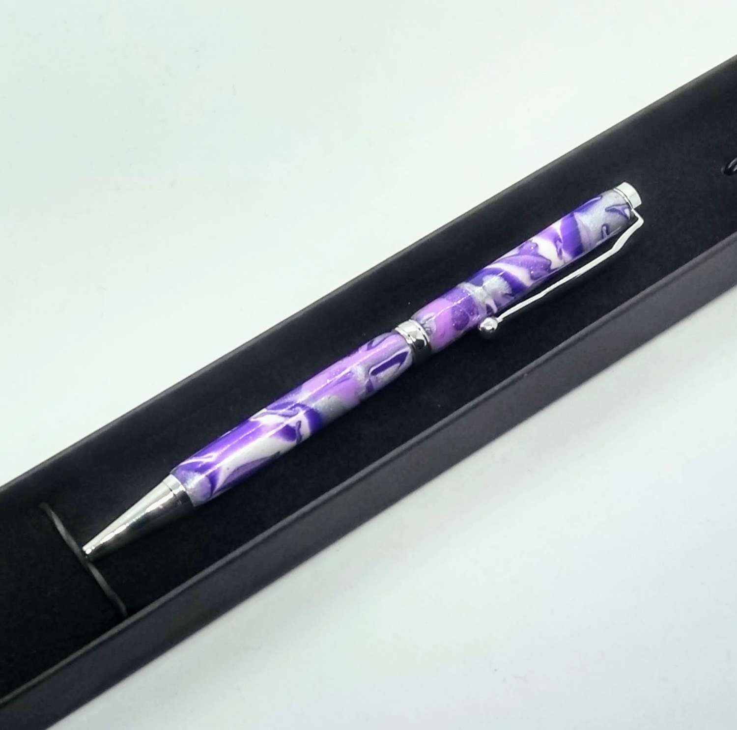 Hand made slimline twist ballpoint pen in purples, lilac, white and silver Hand made slimline twist ballpoint pen in purples, lilac, white and silver
