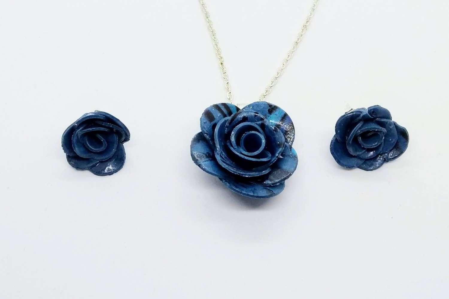 handmade polymer clay rose pendant and earrings in marbled blue handmade polymer clay rose pendant and earrings in marbled blue