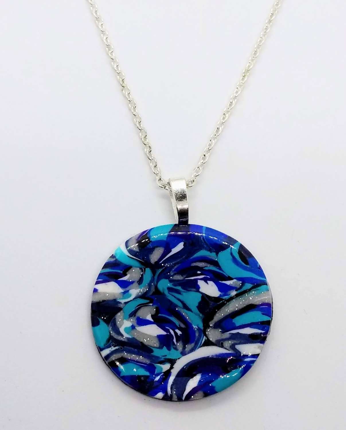handmade polymer clay round pendant in turquoise, blues, white &silver handmade polymer clay round pendant in turquoise, blues, white &silver