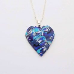 handmade polymer clay headt pendant in turquoise, blues and white