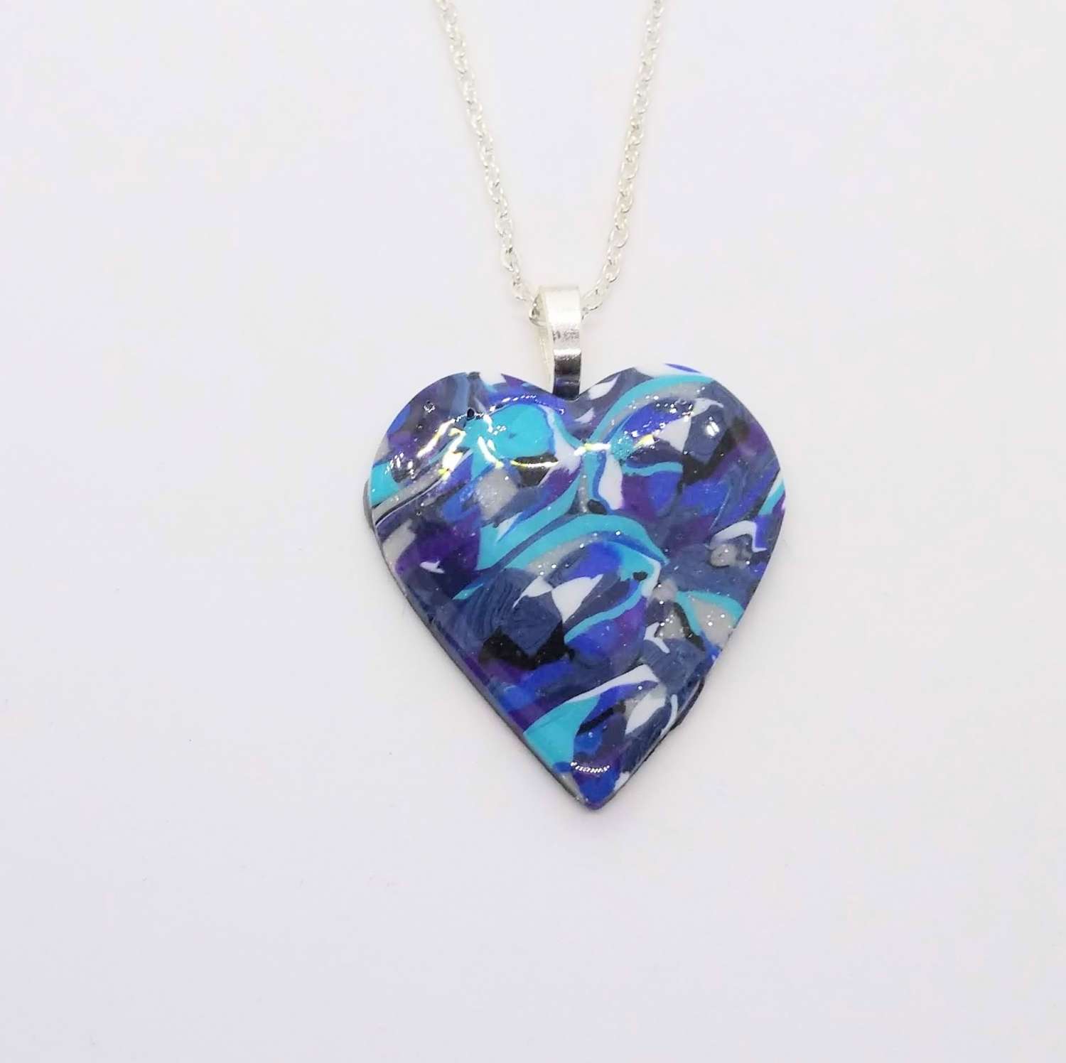handmade polymer clay headt pendant in turquoise, blues and white handmade polymer clay headt pendant in turquoise, blues and white