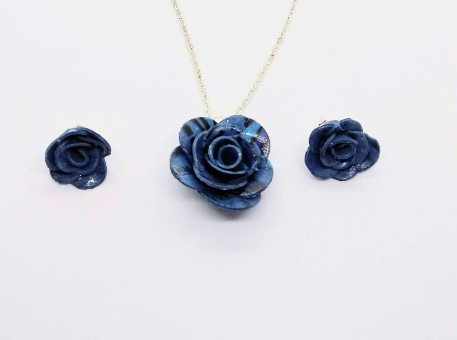 handmade polymer clay rose pendant and earrings in marbled blue handmade polymer clay rose pendant and earrings in marbled blue