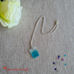 Blue sheer resin pendant necklace