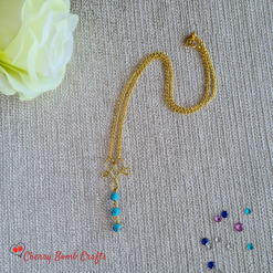 Turquoise beaded necklace on gold wireworked necklace