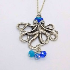 Cute octopus pendant with sparkles and blue drops