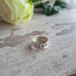 Memory wire ring with silver, grey and white beading