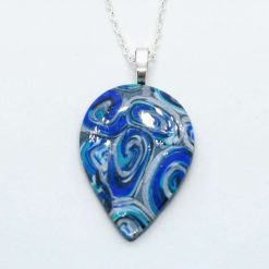 Dark seas. swirly star teardrop pendant in blue and silver