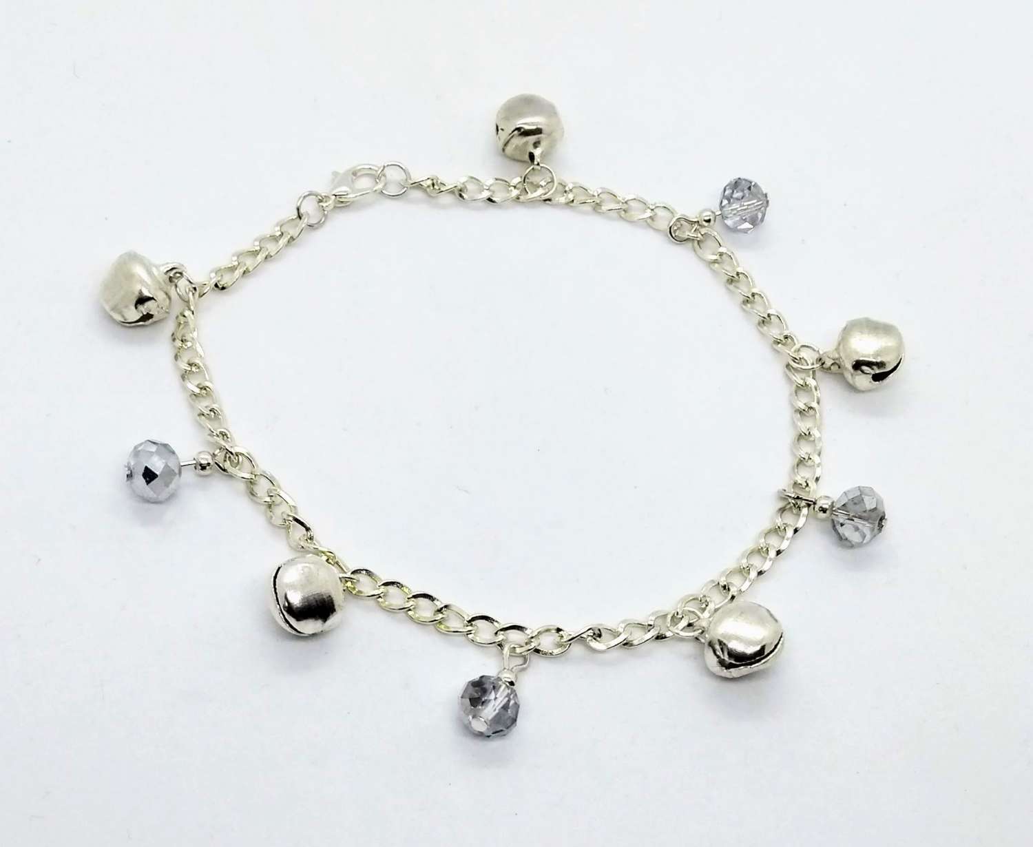 Jingle bells. Bell and silvery drops anklet Jingle bells. Bell and silvery drops anklet