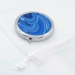 Compact mirror with blue circular swirly design 4