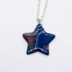 Handmade polymer clay star pendant in blue and copper