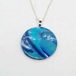 Round pendant in turquoise and sky blue with a touch of silver