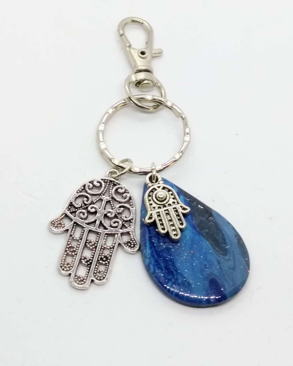 handmade blue teardrop keychain with hamsa hand charm handmade blue teardrop keychain with hamsa hand charm