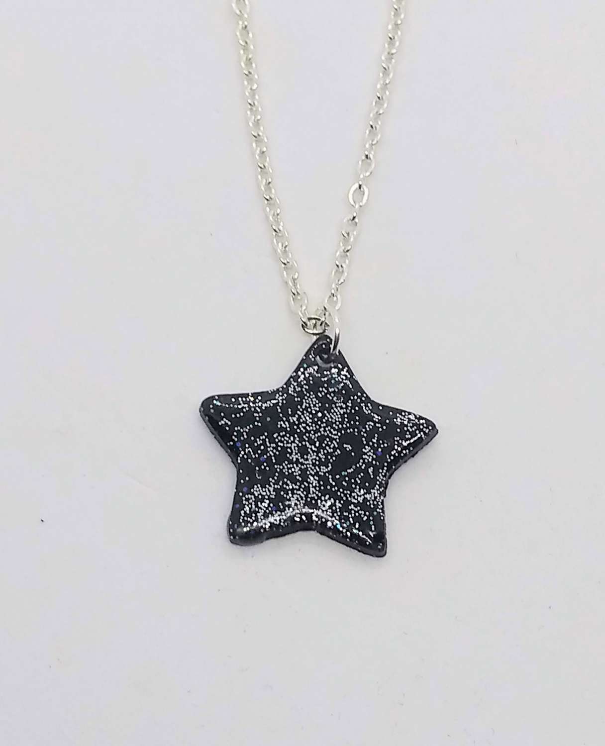 Sparkly night sky. Handmade black polymer clay star pendant with Sparkle Sparkly night sky. Handmade black polymer clay star pendant with Sparkle