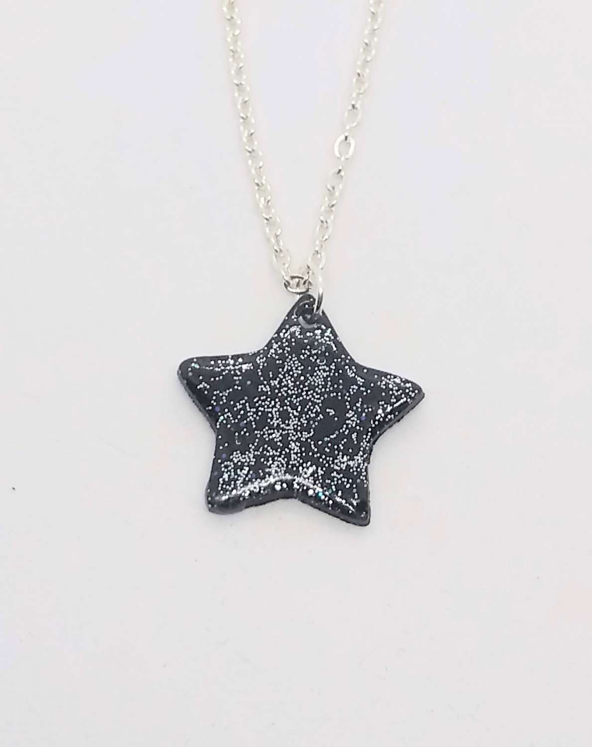 Sparkly night sky. Handmade black polymer clay star pendant with Sparkle Sparkly night sky. Handmade black polymer clay star pendant with Sparkle