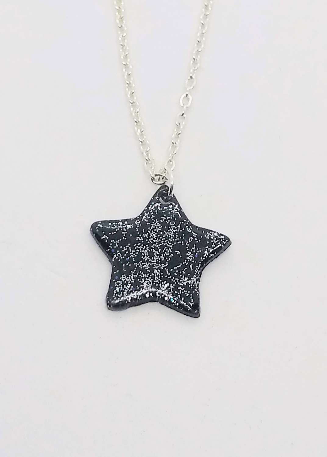 Sparkly night sky. Handmade black polymer clay star pendant with Sparkle Sparkly night sky. Handmade black polymer clay star pendant with Sparkle