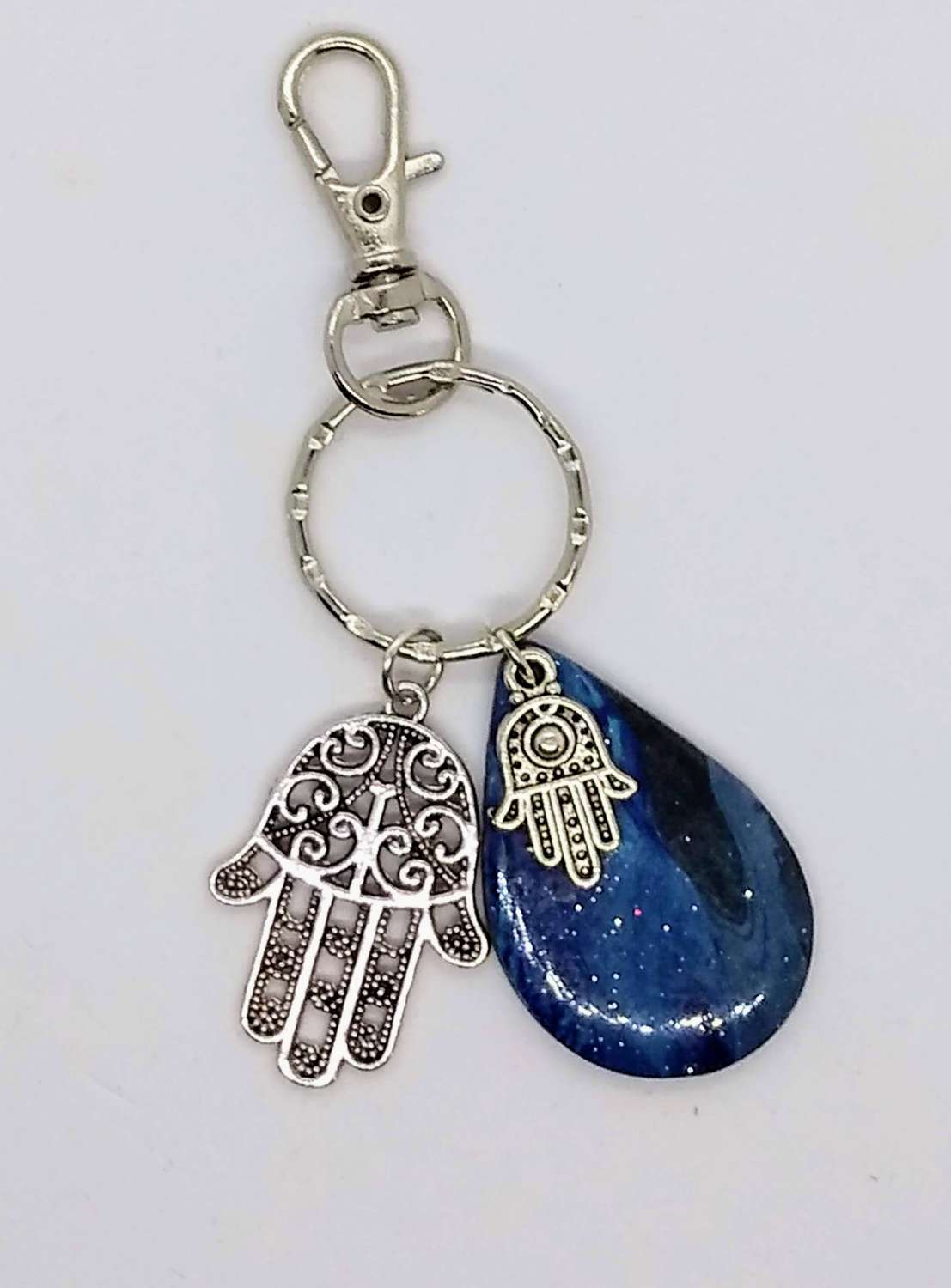 handmade blue teardrop keychain with hamsa hand charm handmade blue teardrop keychain with hamsa hand charm