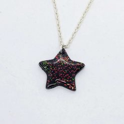 Christmas star. Handmade black polymer clay star pendant with Sparkle