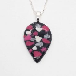 handmade polymer clay teardrop pendant on black, pink and silver