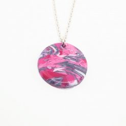 handmade polymer clay round pendant in marbled pinks and purples