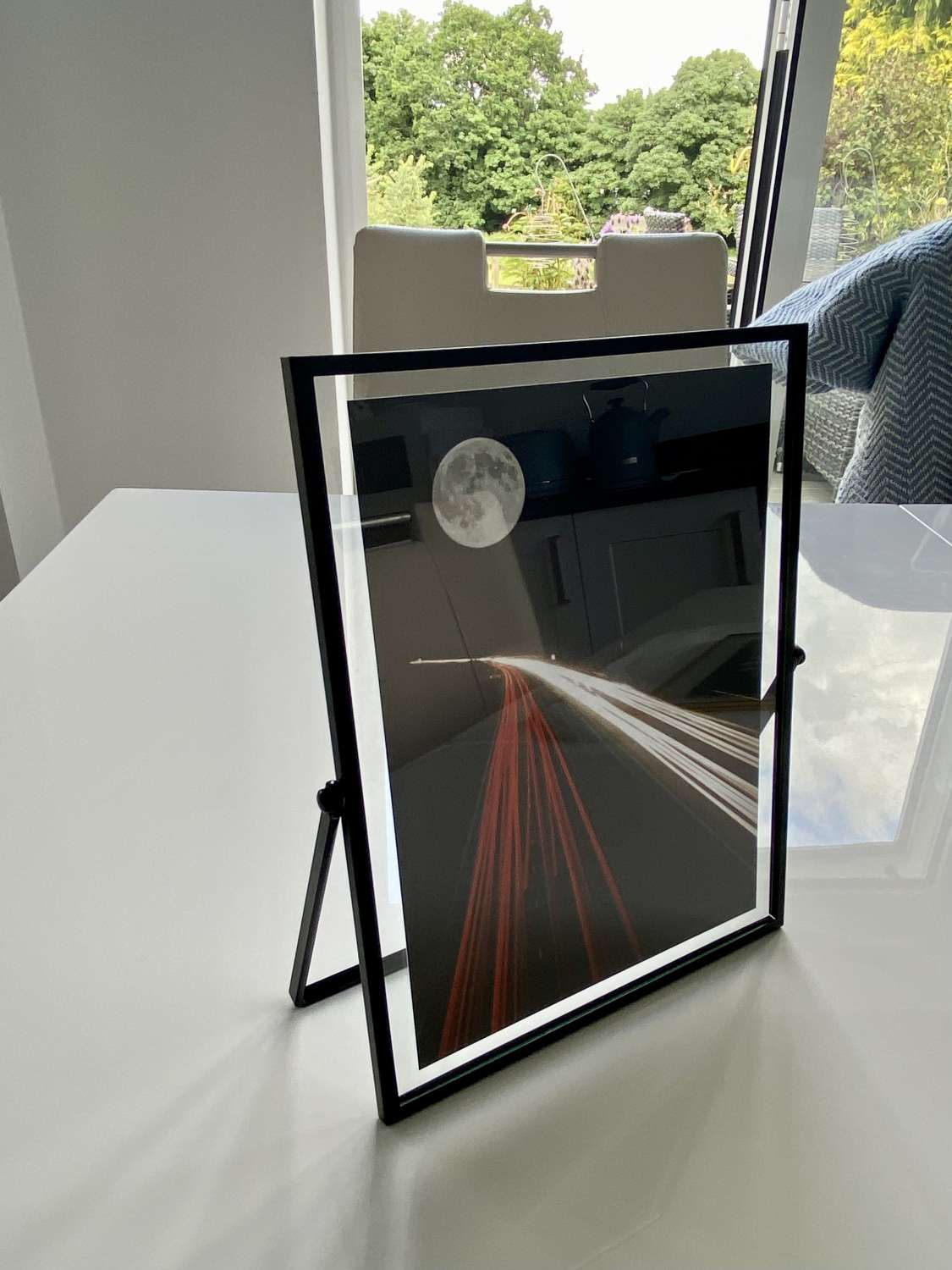 Moon Highway in glass window frame Moon Highway in glass window frame