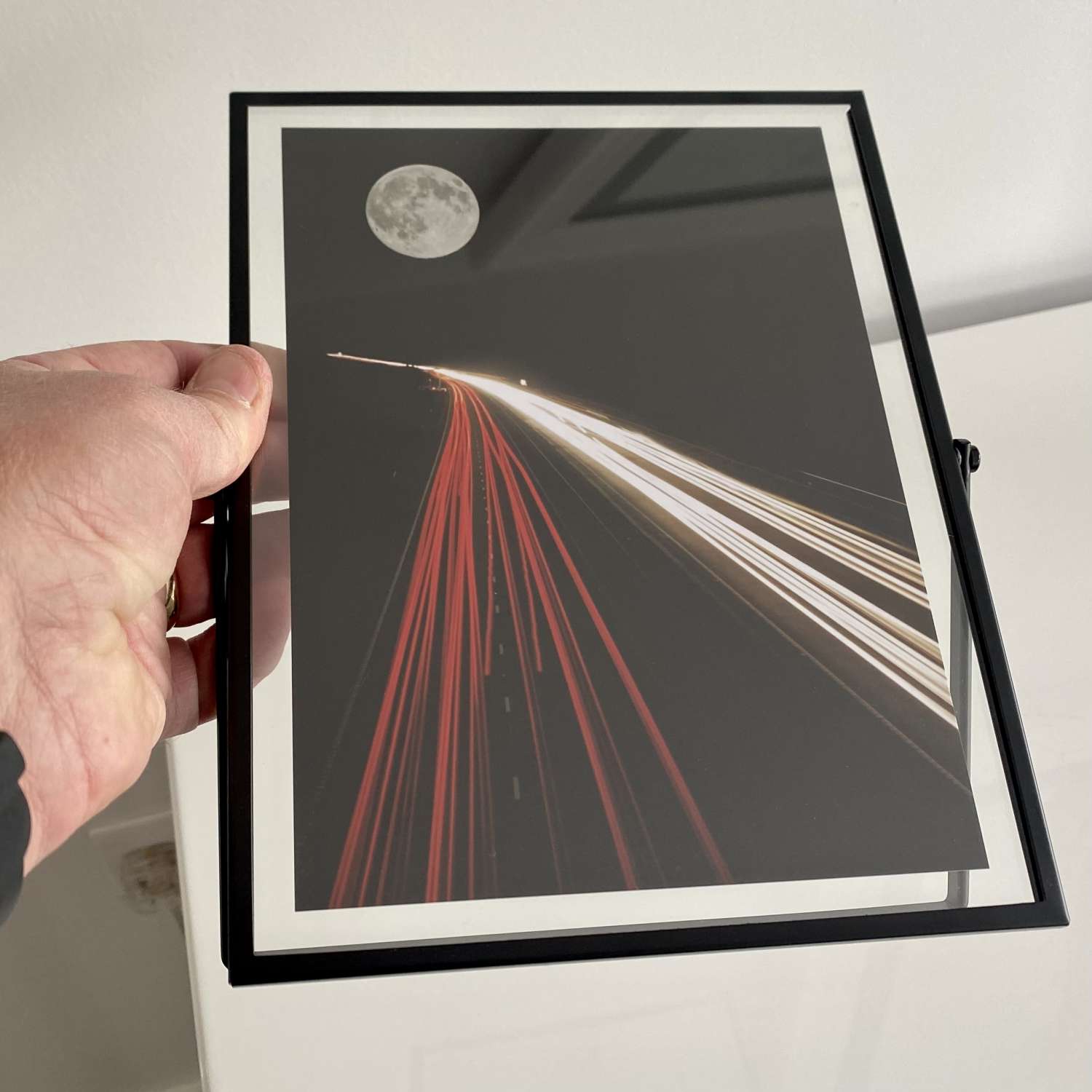 Moon Highway in glass window frame Moon Highway in glass window frame
