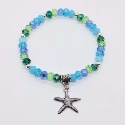 Seaside stretch sparkly bracelet in seaside shades with a starfish charm
