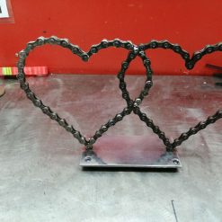 no.1 Double love hearts  Bicycle chain on 3mm thick metal plate with 10 mm ballbearings underneath base plate which you can see from the top is polished as best we can considering it is scrap The price includes shipping TO UK ONLY Please contact us for Overseas shipping Height 6.5 inches (160) and width 10.5inches (265)