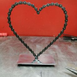 no.1 Single love hearts  Bicycle chain on 3mm thick metal plate with 10 mm ballbearings underneath base plate which you cant see from the top is polished as best we can considering it is scrap The price includes shipping TO UK ONLY Please contact us for Overseas shipping Height 8 inches (200) and width 7inches (185)