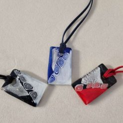 Glass Pendants Hanging from a Faux Suede Necklace