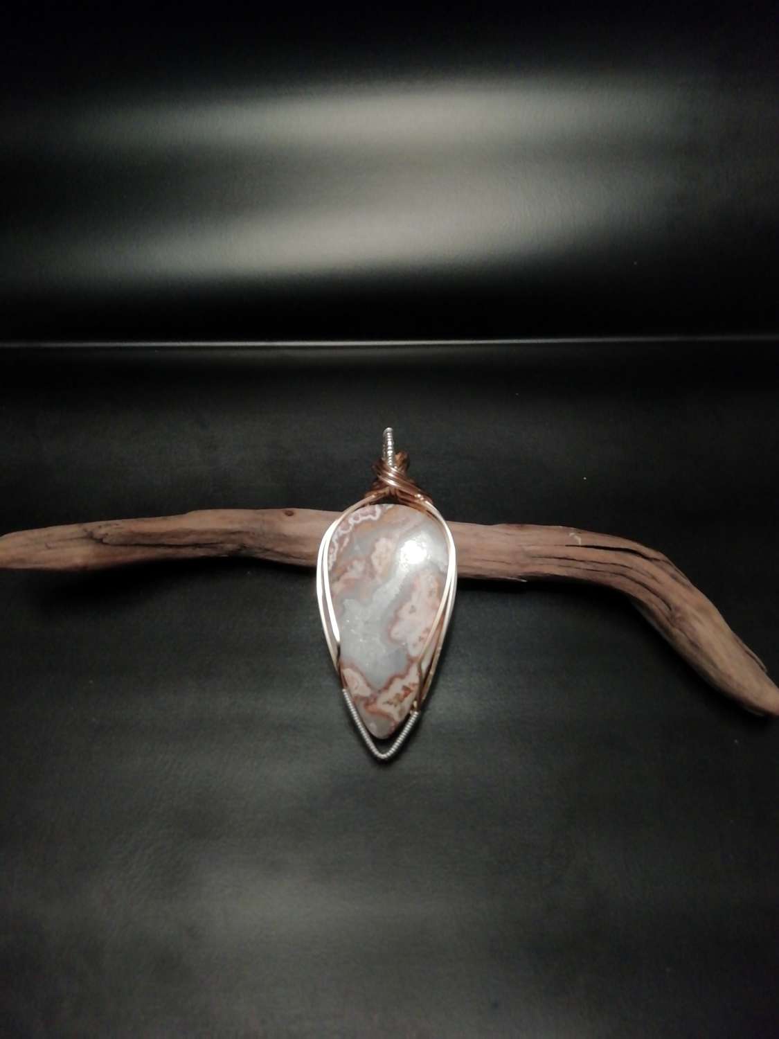 Lace agate pendant set in brass and silver. Lace agate pendant set in brass and silver.