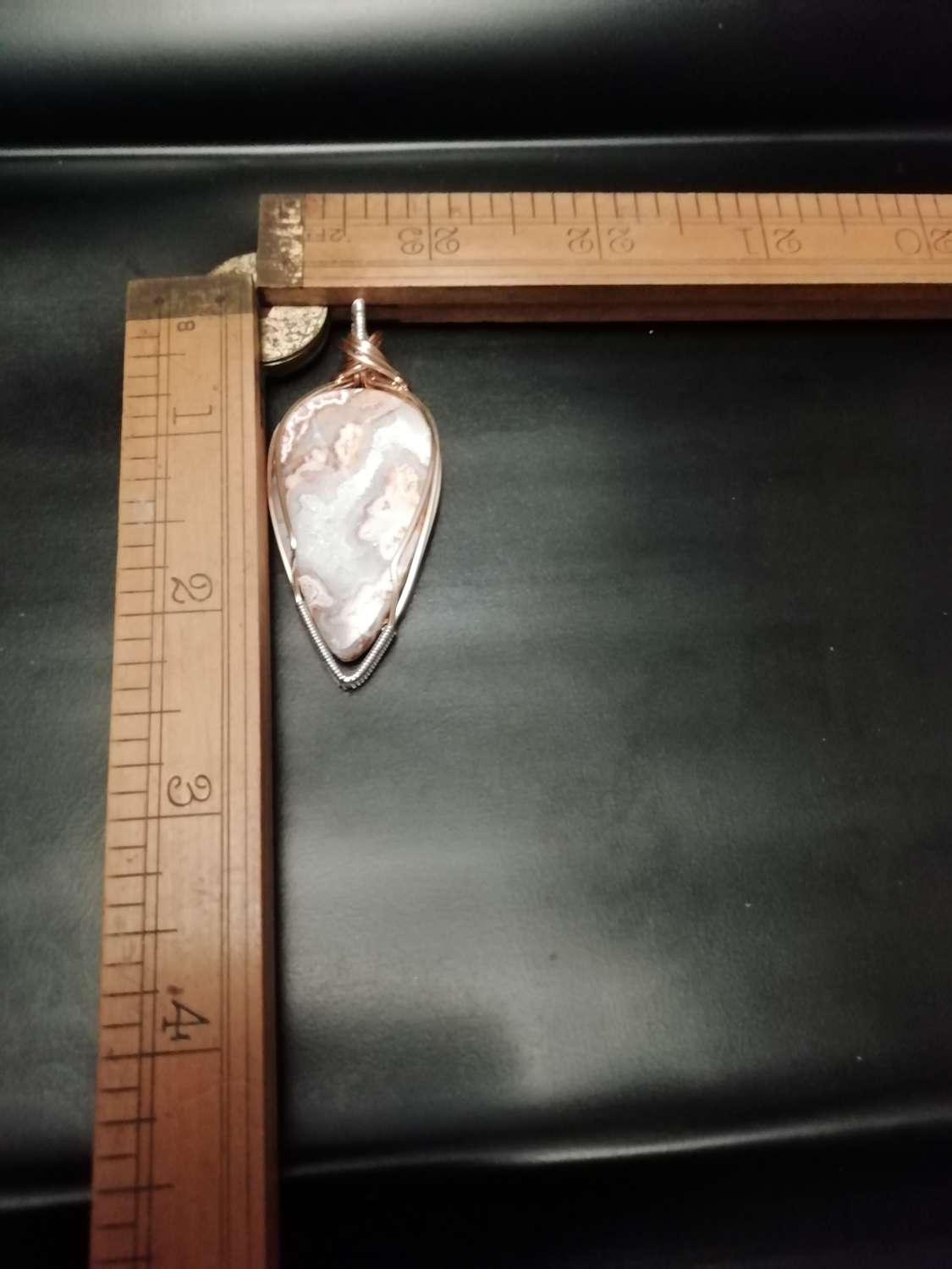 Lace agate pendant set in brass and silver. Lace agate pendant set in brass and silver.
