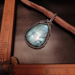 Blue labradorite pendant wrapped in silver metal