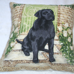 Black Labrador by garden gate cushion