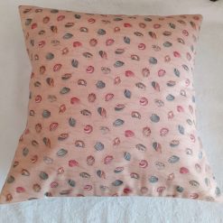 Seashells on pink cushion
