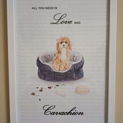 Cavachion Print, Dog Wall Art, Cavachion wearing a pink side hair bow sitting in a cosy Dog Bed, Home Decor, Dog Lover Framed Print