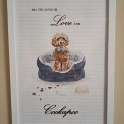 Cockapoo Print, Dog Wall Art, Brown Cockapoo wearing a light Blue Polka Dot Bow Tie sitting in a cosy Dog Bed, Home Decor, Dog Lover Framed Print