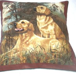 Two golden retrievers eagerly ready and waiting for action cushion