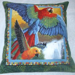 Macaws flying through a tropical forest cushion