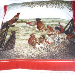 A Tabby cat watching chickens and chicks on the farm cushion