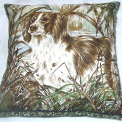 Brown and white Spaniel eagerly ready and waiting for action cushion pillow