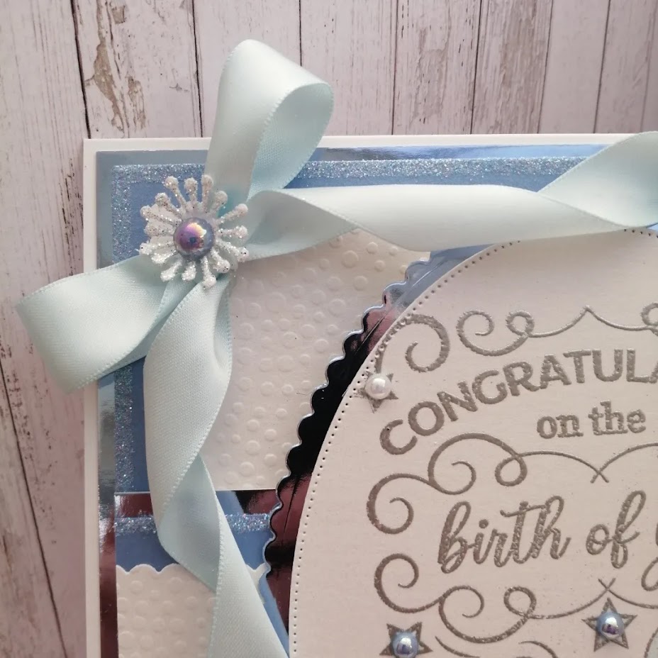 Luxury Handmade New Baby - Congratulations on the birth of your Baby Boy - Oval sentiment to centre with embossed background and pretty pale blue bow & ribbon Luxury Handmade New Baby - Congratulations on the birth of your Baby Boy - Oval sentiment to centre with embossed background and pretty pale blue bow & ribbon