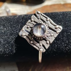 Striking square bangle with glass cabochon