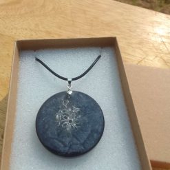 Black and silver resin pendant