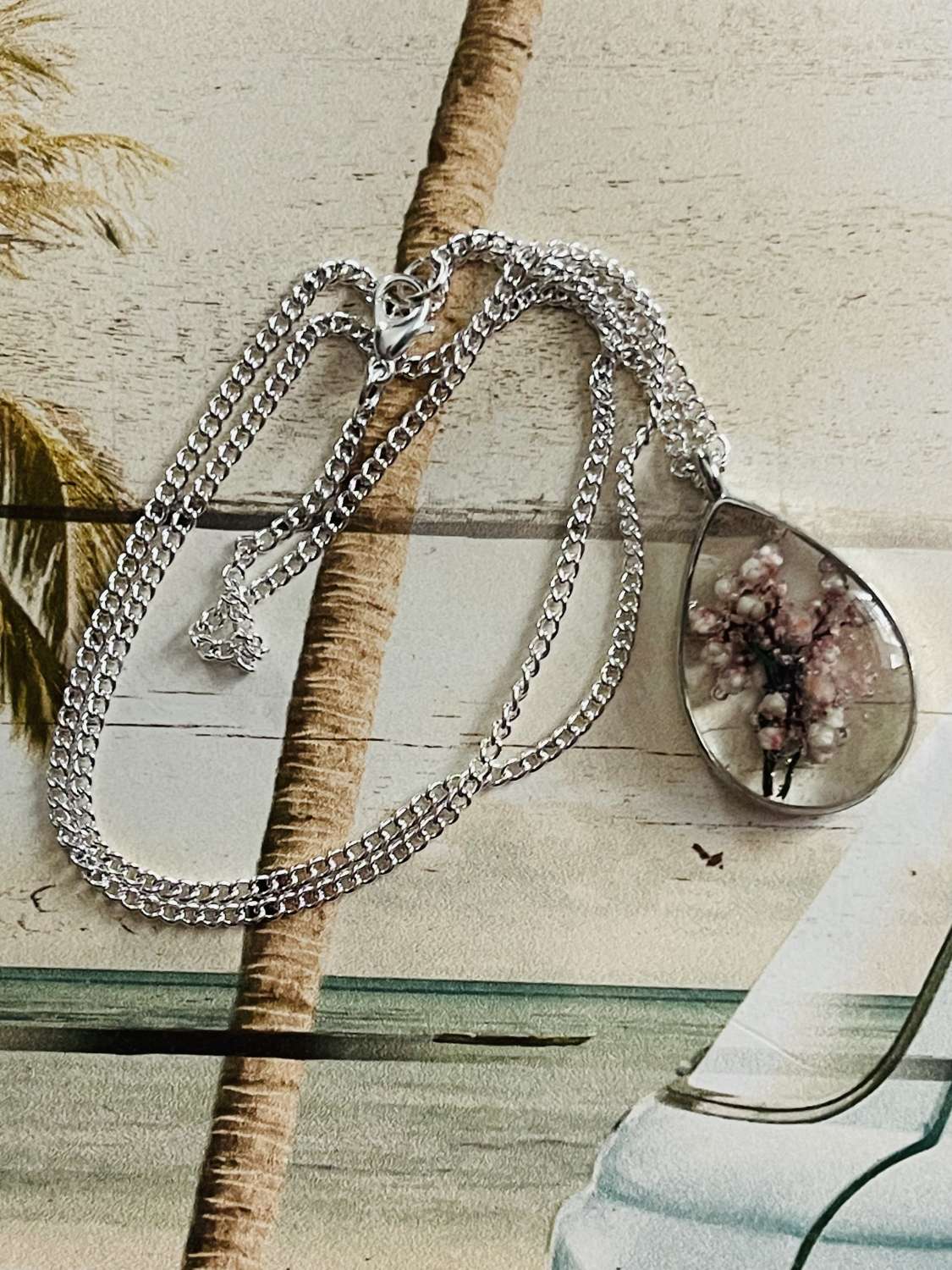 Oval Resin real dried flower Pendant on a 20" Silver Chain Oval Resin real dried flower Pendant on a 20" Silver Chain
