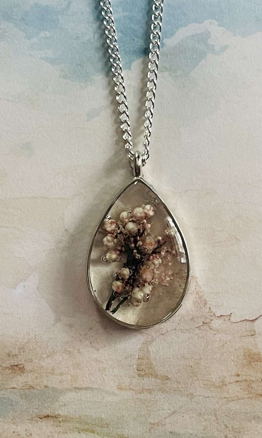 Oval Resin real dried flower Pendant on a 20" Silver Chain Oval Resin real dried flower Pendant on a 20" Silver Chain